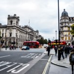 group of people gathered near gray concrete structure