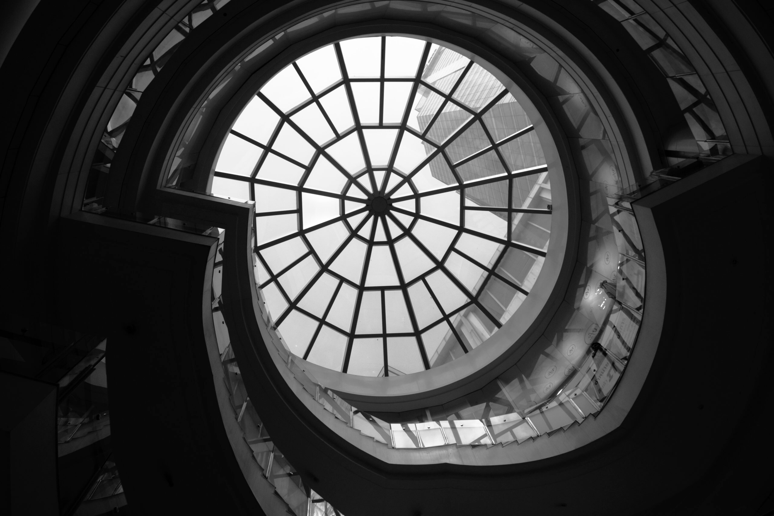 low-angle photo of clear glass ceiling