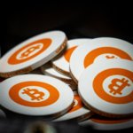 white and orange bitcoin chips