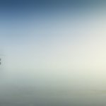 rule of thirds photography of man on boat
