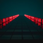 black pathway between red LED light rails