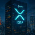 A glowing XRP logo illuminates Gumi’s skyscraper in Tokyo’s skyline as part of its treasury reserve strategy - Cover art/illustration via CryptoSlate. Image includes combined content which may include AI-generated content