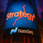 The Strategy logo appears cracked on a Nasdaq digital billboard in Times Square as crypto scrutiny intensifies - Cover art/illustration via CryptoSlate.