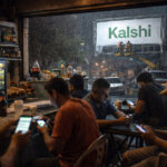 People using betting apps on smartphones inside a bar as a Kalshi billboard is installed outside in the rain, symbolizing the platform’s Brazil launch amid a national gambling addiction crisis