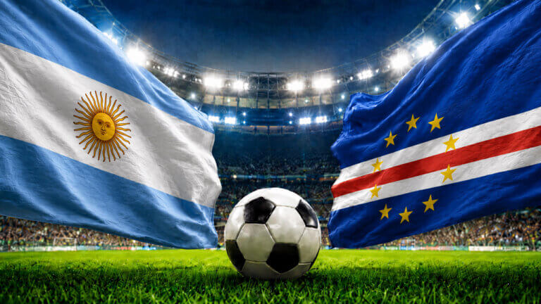 Argentina and Cape Verde flags face off above a soccer ball in a packed stadium, representing a FIFA World Cup prediction market matchup.