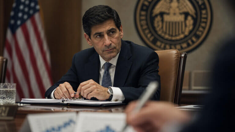 Federal Reserve official reviewing policy materials ahead of an FOMC meeting, representing July Fed rate decision expectations and interest-rate market forecasts.