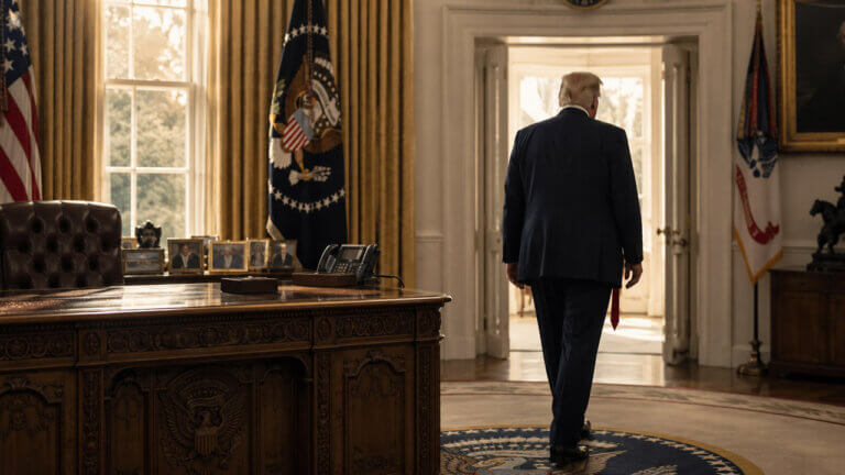 Donald Trump walking away from the Resolute desk toward an open Oval Office doorway, suggesting an early departure from the presidency.